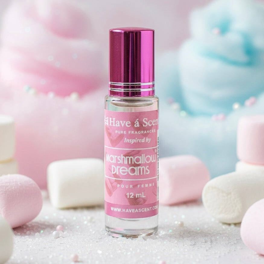 Perfume bottle labeled 'Have a Scent' with pink packaging, surrounded by marshmallow-like candies.