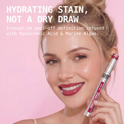 Peel-off stain lip liner with applicator brush, deep berry shade, held beside face.