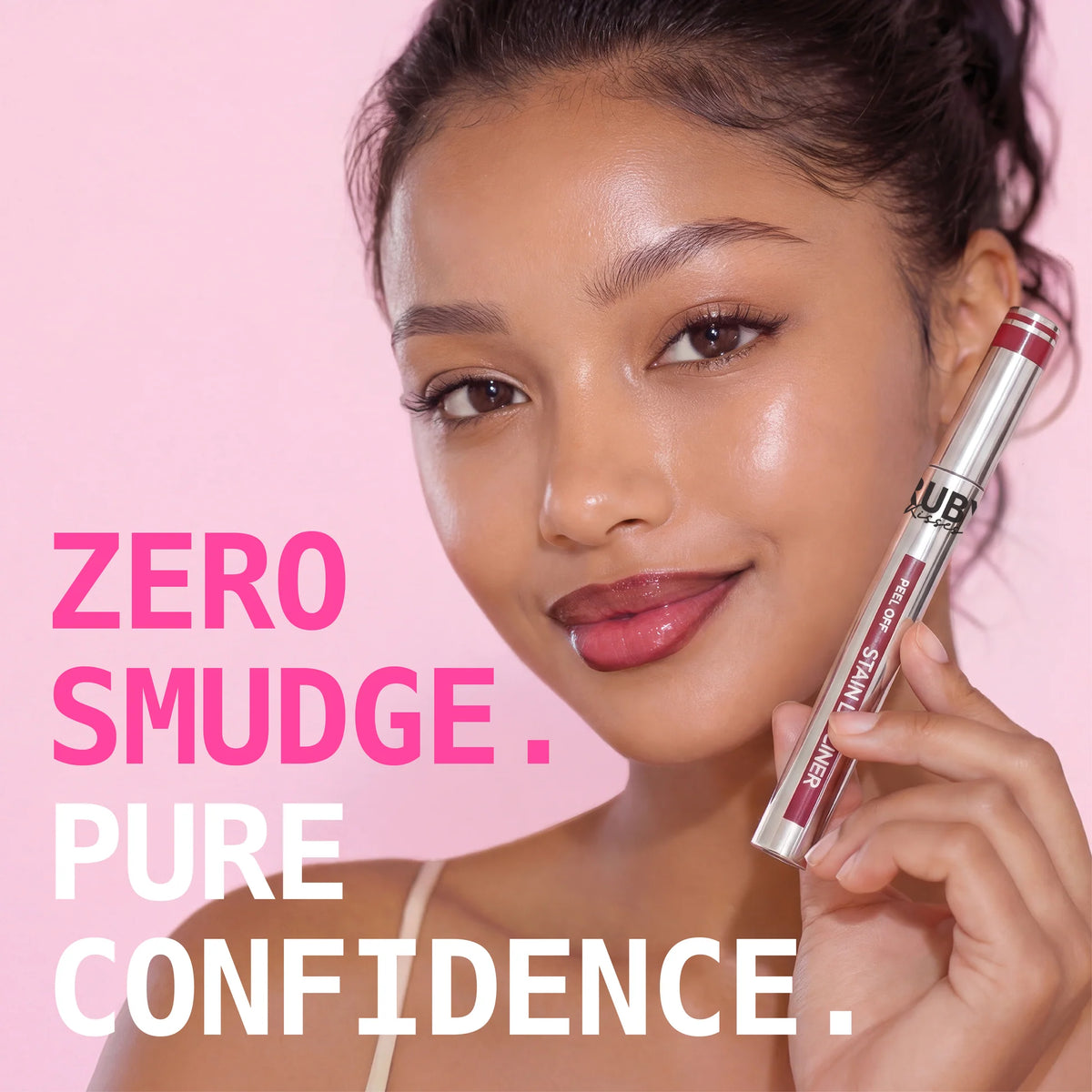 Peel-off stain lip liner with applicator brush, rose-pink shade, held near lips.